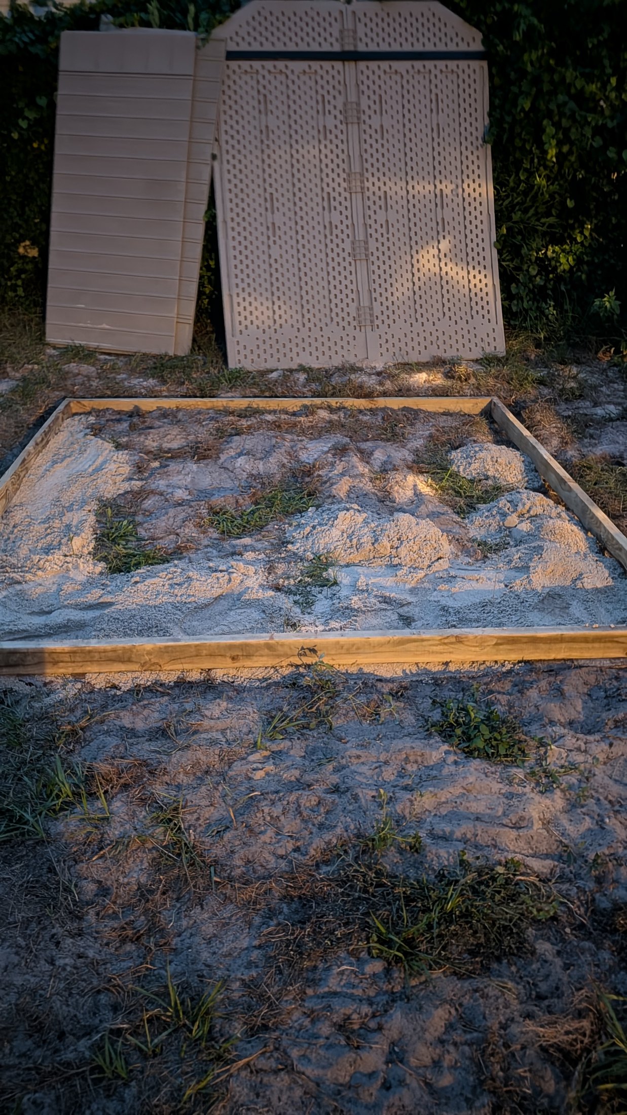 Shed foundation frame during nighttime excavation