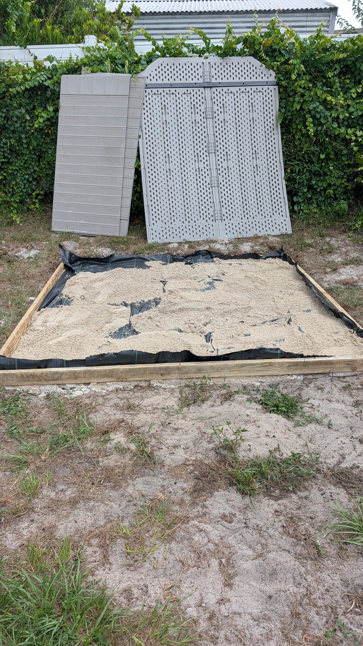 Framed shed foundation filled and graded with paver base