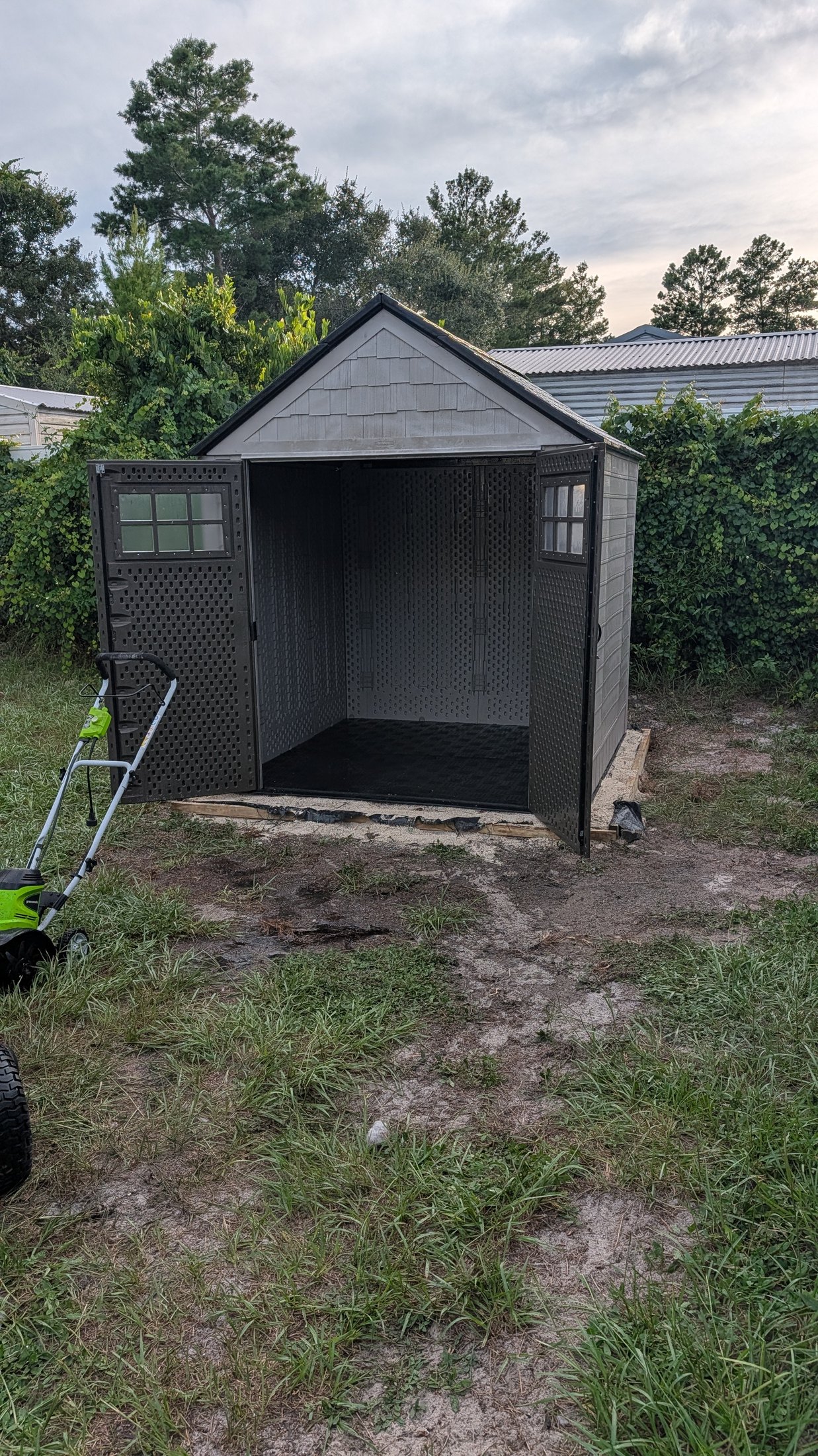 The completed shed standing open and ready for storage
